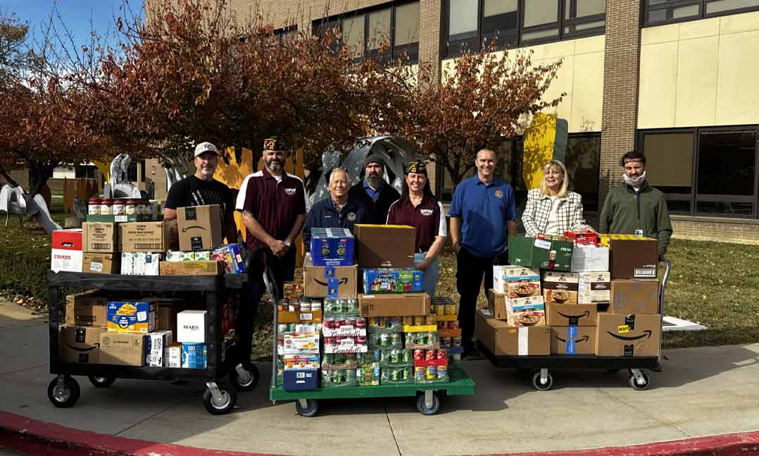 VFW Post 12218 Senior Vice Commander Mike Jeffery and Post Quartermaster Tarah Jeffery join Martinsburg Veteran Affairs Medical Center staff members in transporting food donations