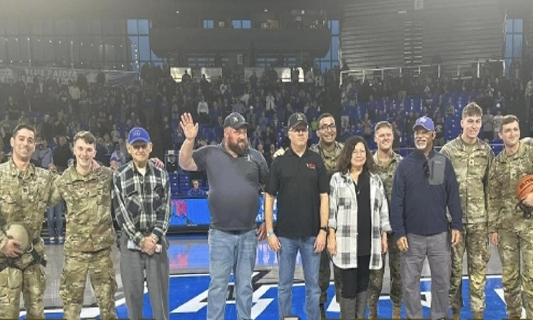Members of VFW Post 4575 and members of the Middle Tennessee State University (MTSU) ROTC are welcomed onto the court of an MTSU home basketball game 