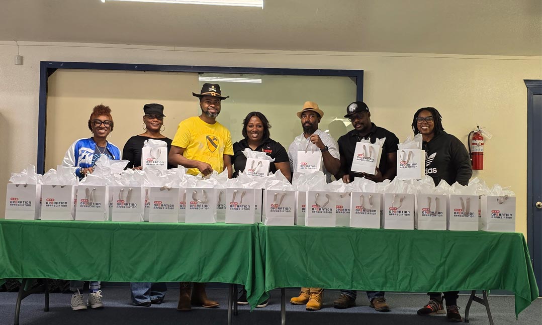 VFW Post 12209 adjutant Juanita Myers, center, joins members of her Post in celebrating the donation of appreciation bags from Operation Appreciation 