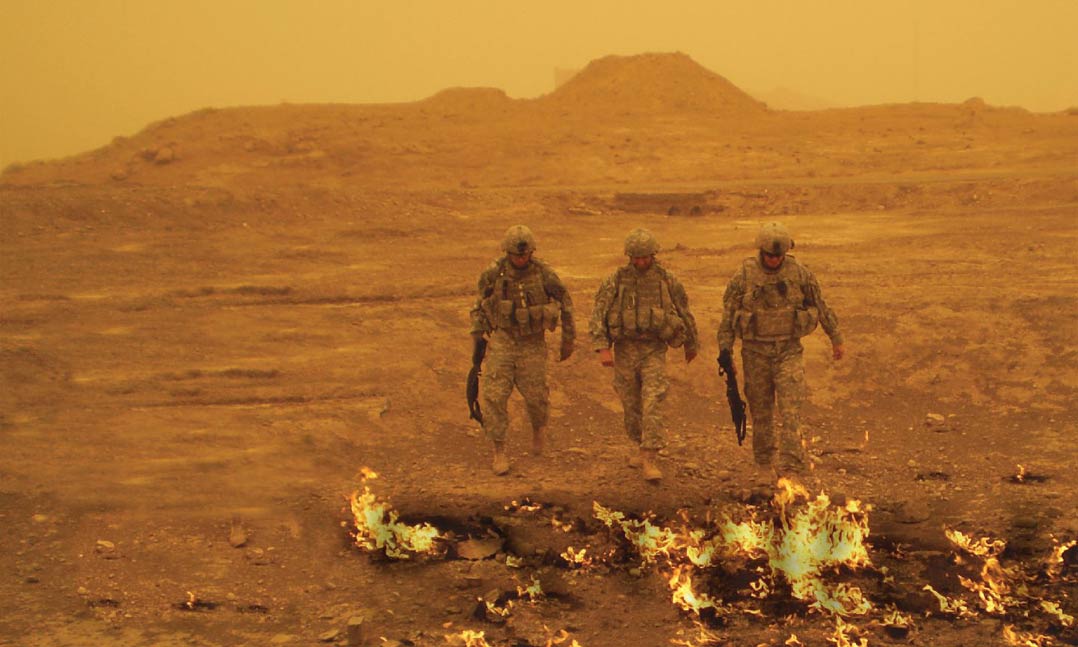 Army Maj. Chaplain Paul Passamonti, center, at Kirkuk on Sept. 19, 2002.