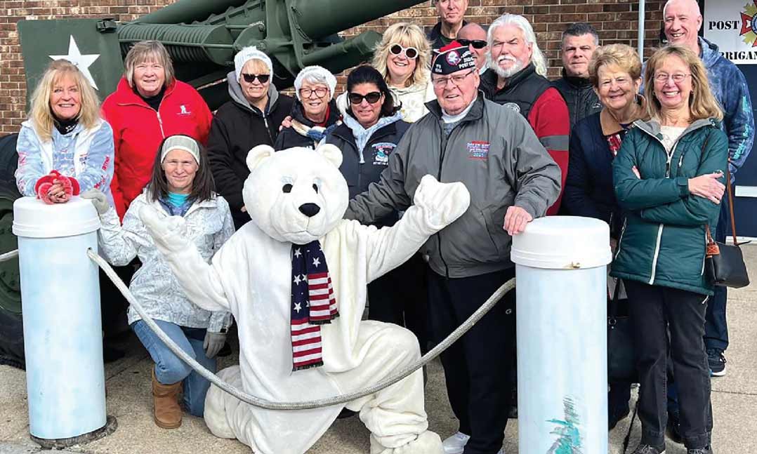 VFWPost 6964 Commander Mario Perrucci, center, gathers with volunteers in December 2024 at the Post in Brigantine, New Jersey.