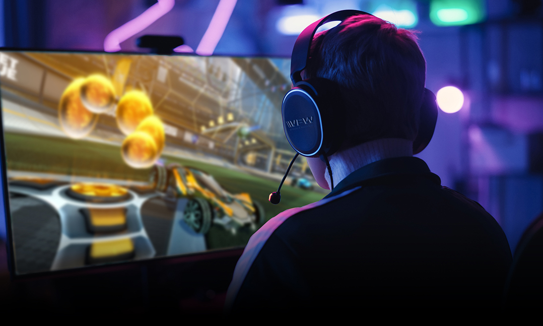 VFW Combat Tested Gaming veteran wearing VFW headphones gaming at a computer