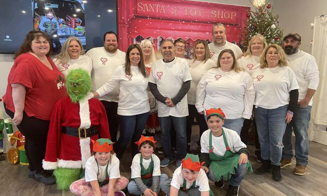 A group poses for a picture at a toy drive during the holidays