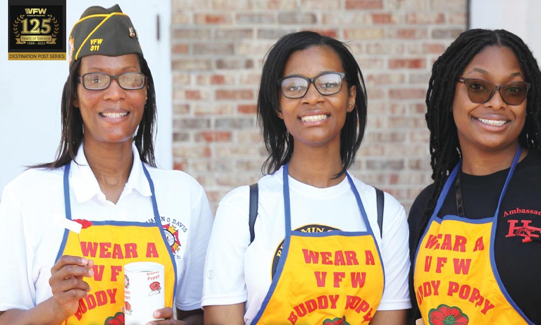 VFW Post 311 Jr. Vice Commander Ericka Hilliard distributes Buddy Poppies with her daughter and a friend last year in Richton Park, Ill.