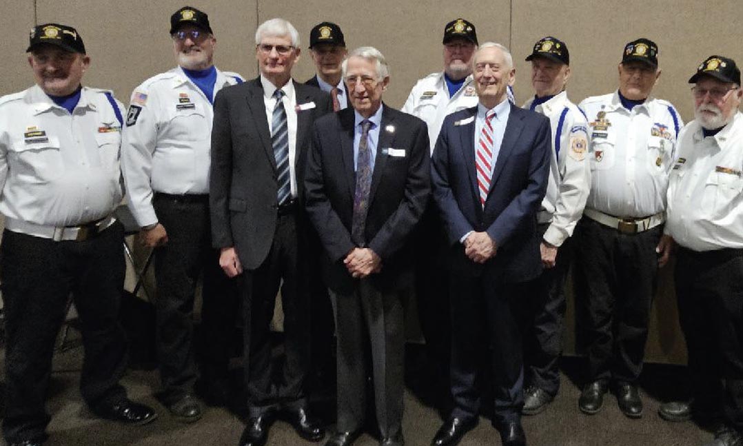 Kevin Veleke, left of center, celebrates his achievement with fellow VFW Post 5785 members