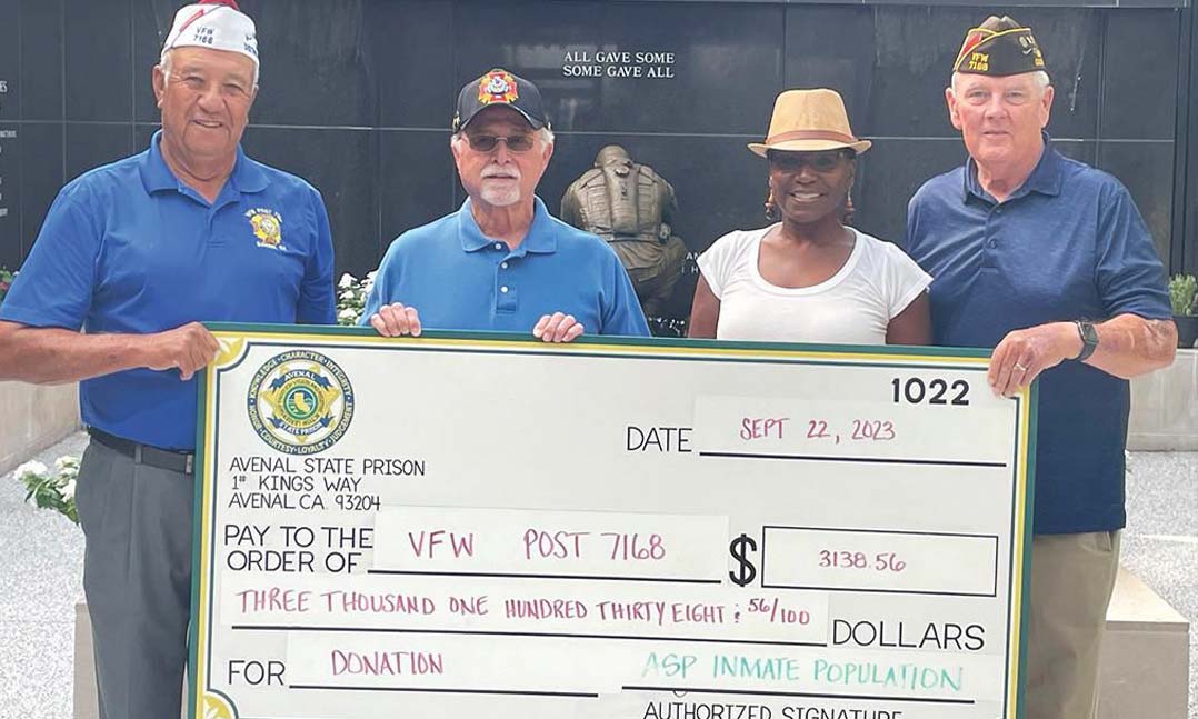 VFW Post representatives accept a donation from local Veterans Group of Avenal prisoners