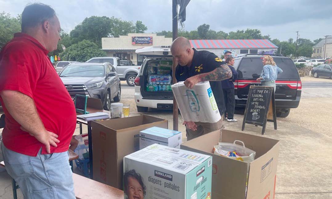 Members of VFW Post 12235 in Salado, Texas, collect donations for flood victims