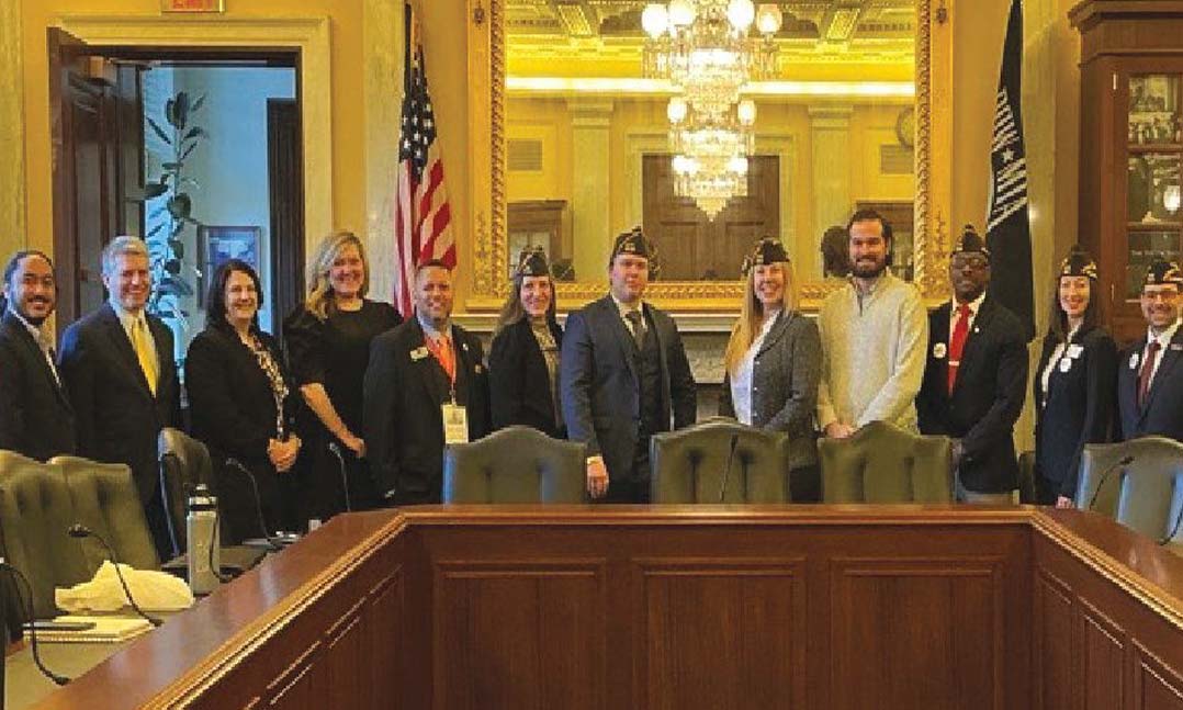 Members of the Fellowship line up for a picture with other members of the meeting in Representative Mike Bost’s office during Washington Week, March 2025.