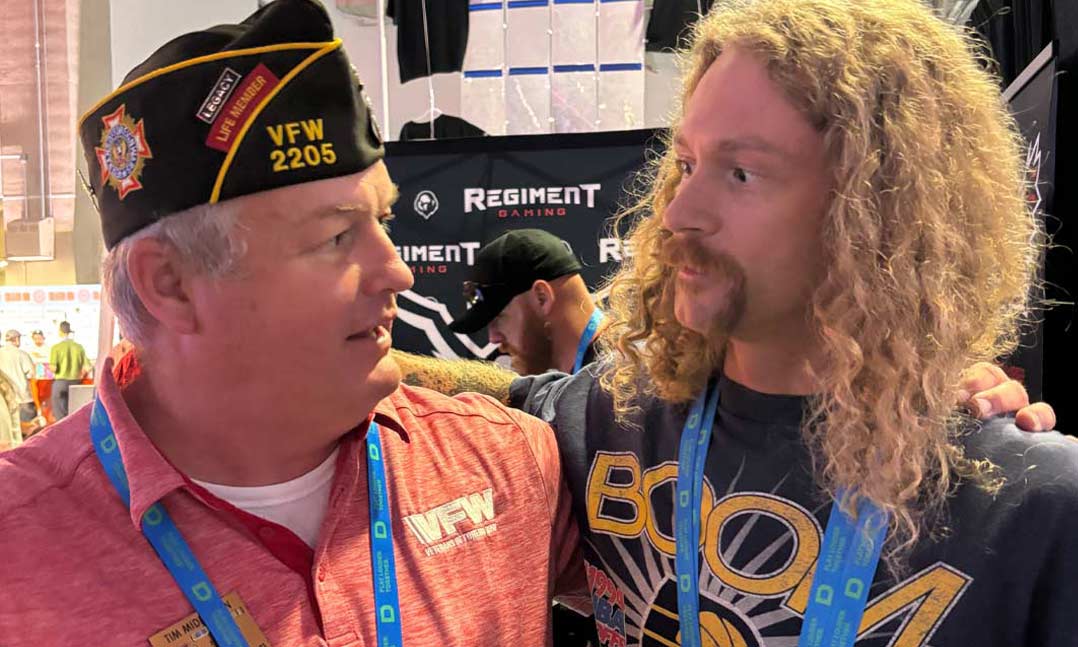 VFW Post 2205 Commander Tim Middleton, left, chats with veteran gaming influencer “AmericanDad” at the Dallas-based video gaming event DreamHack on May 23