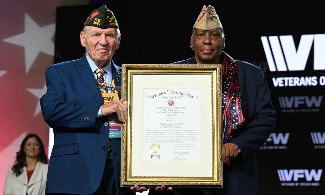 VFW National Commander Al Lipphardt presents the Service Officer of the Year Award to Belinda Boldoe